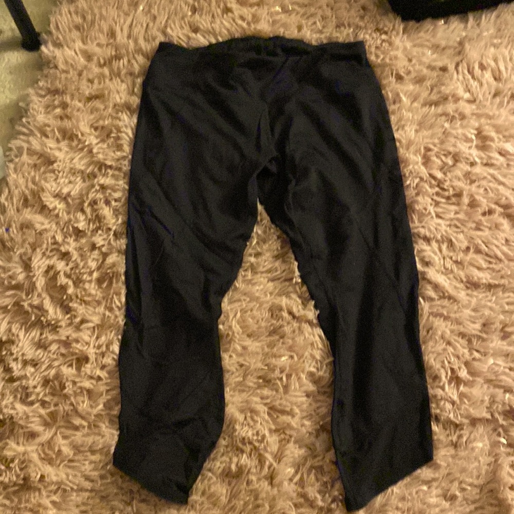 Size medium black athletic capris with mesh on bottom